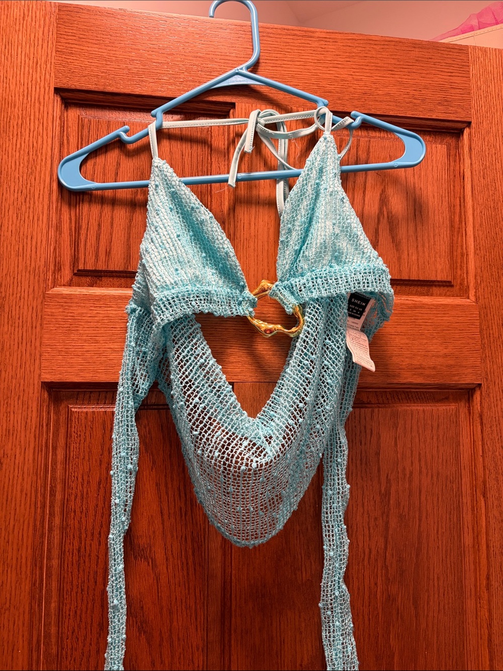 Light blue going out top with gold ring